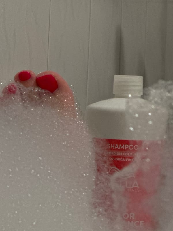 Red-painted toes in a bubble bath, Krefeld