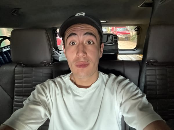 Man photographed lying upside down in vehicle backseat