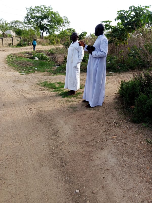 Daily life unfolds on dirt roads in Zango-ndaji