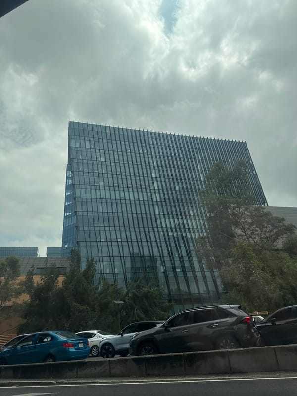 Modern skyscraper photographed from street level in Mexico City