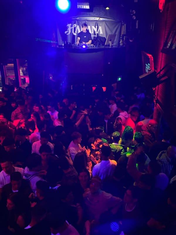 Packed nightclub scene captured in Gijón with DJ and lasers