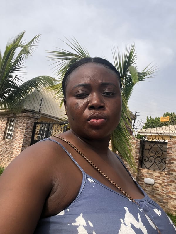 Woman takes selfies on sunny day in Abuja