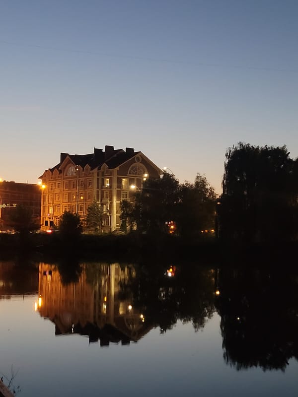 Evening stroll along a Kyiv canal at dusk