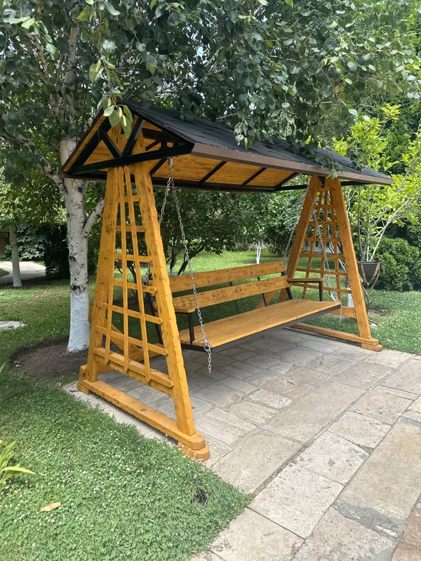 Lush garden scenes: whitewashed trees, swing set, and lily pond