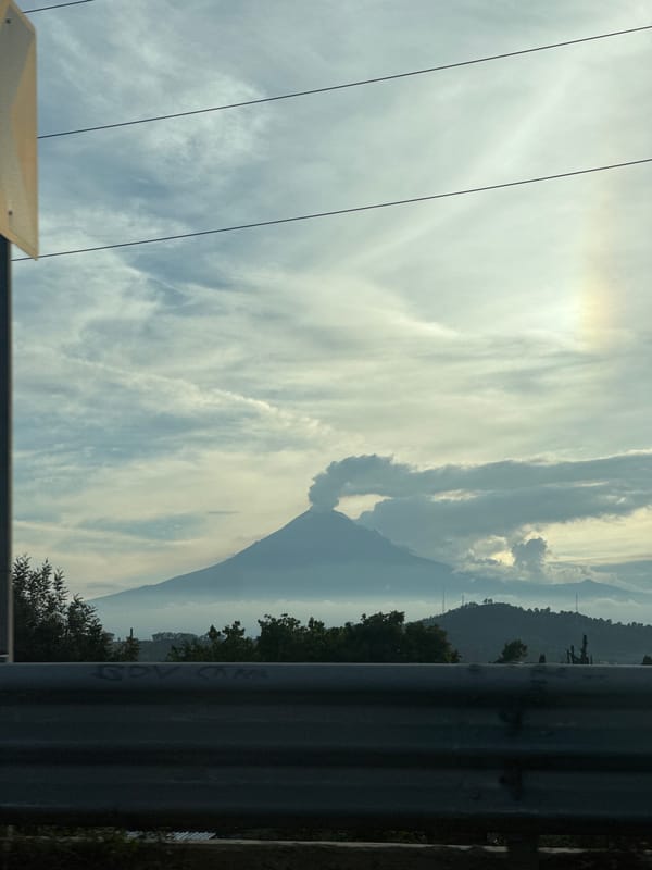 Popocatépetl volcano observed under cloudy skies in Cholula