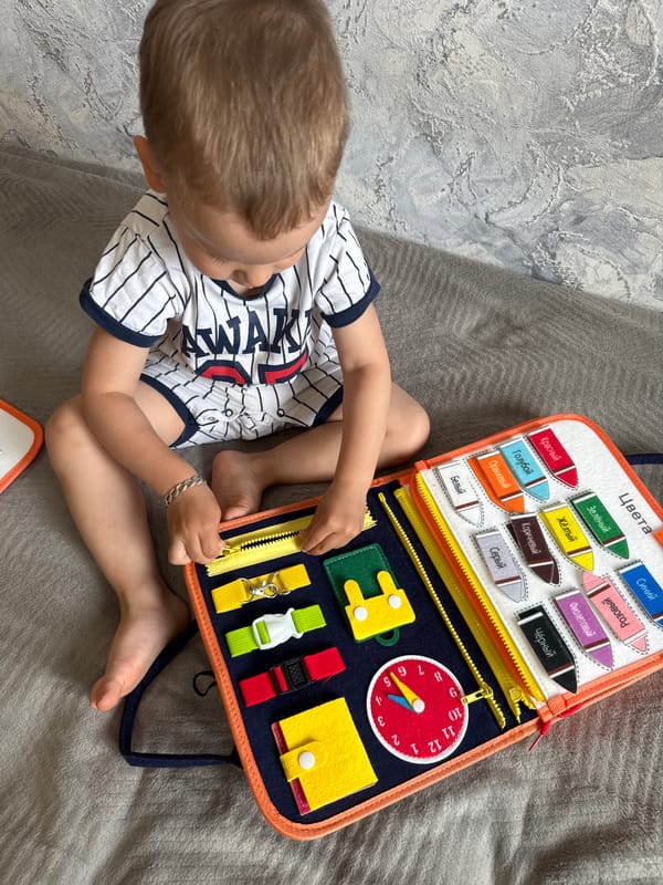 Child plays with educational toys during early morning in Russia