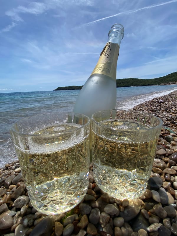 Sparkling wine enjoyed on Montenegro's Prijevor beach morning