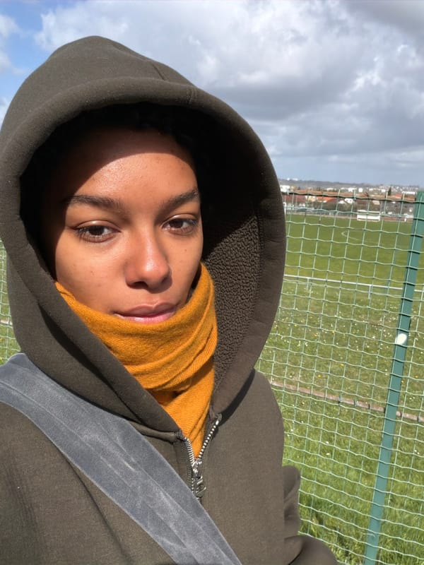 Person photographed in hoodie and scarf in Champs-sur-Marne