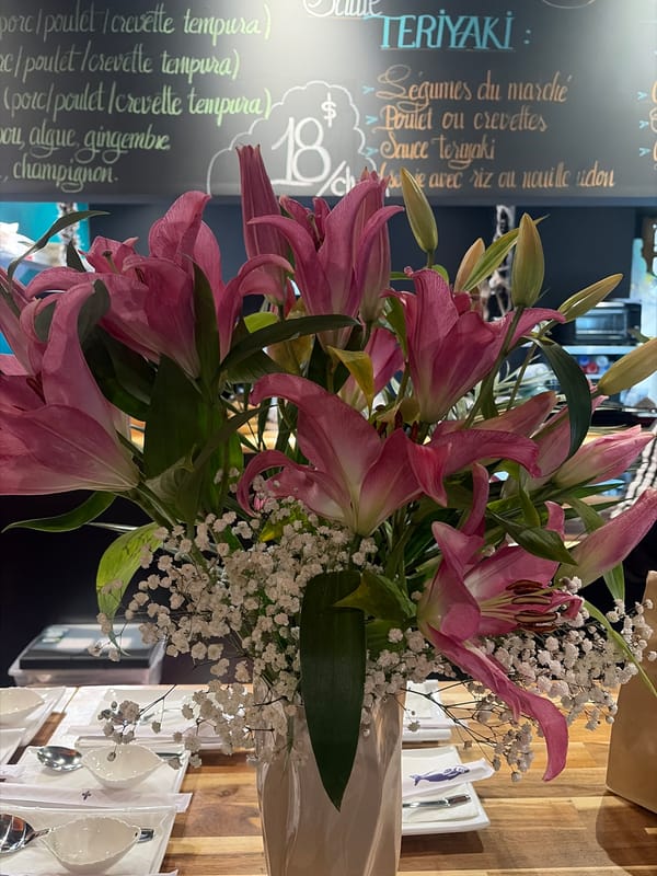 Pink lily bouquet displayed at Montreal restaurant teriyaki menu