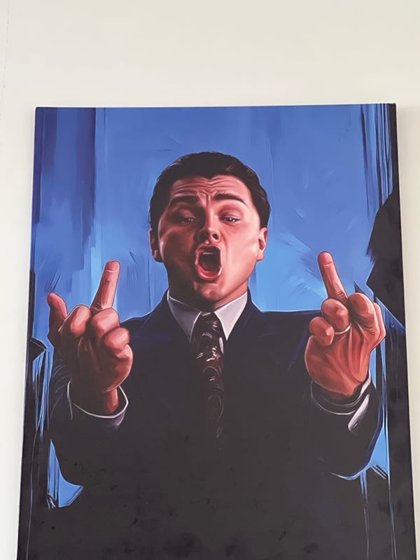 Canvas artwork shows suited man making obscene gesture in Astana