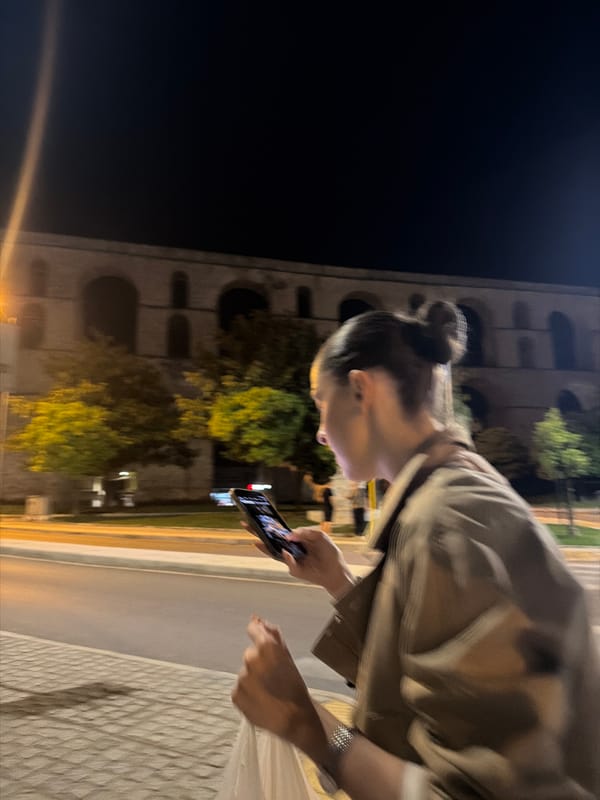 Nighttime street life documented around Kavala's historic aqueduct district