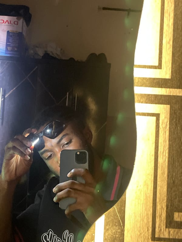 Man takes mirror selfies in Lokoja, Nigeria residence
