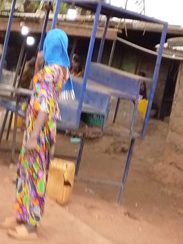 Woman and child with bicycle spotted in Tamale Ghana