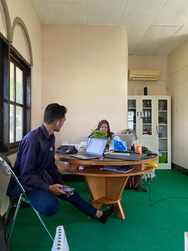 Casual office gathering in Banjarbaru, mid-work moment