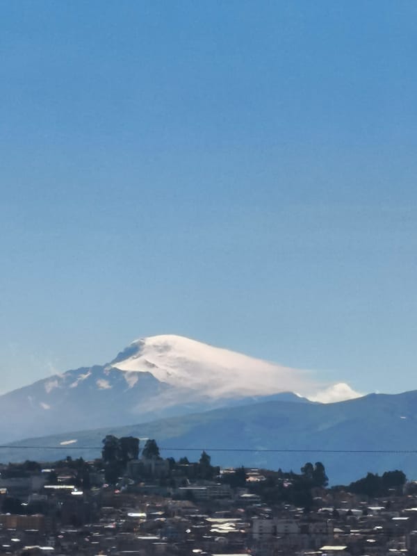 Clear mountain view captured over Quito's urban landscape