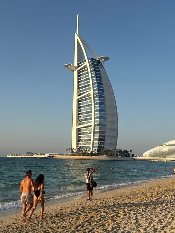 Tourist moments captured at Dubai's Jumeirah Beach near Burj Al Arab