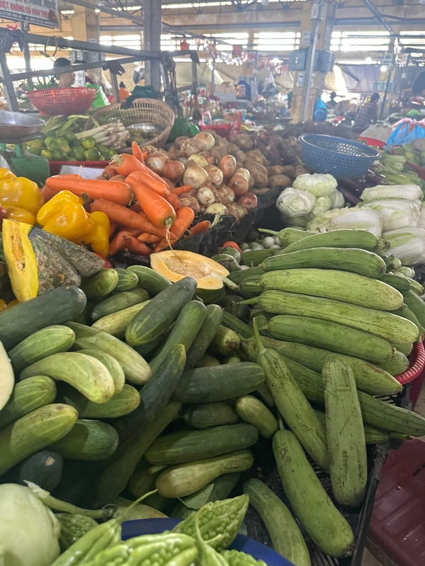 Inside a busy Nha Trang market, fresh produce and dried seafood on display