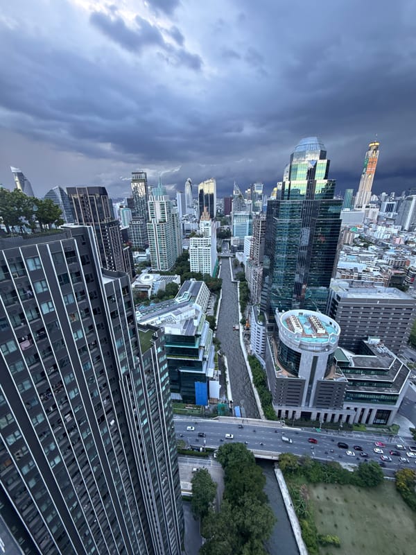 Bangkok skyline under stormy skies, July 2026