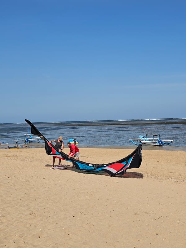 Large kite prep underway on a sunny Bali beach