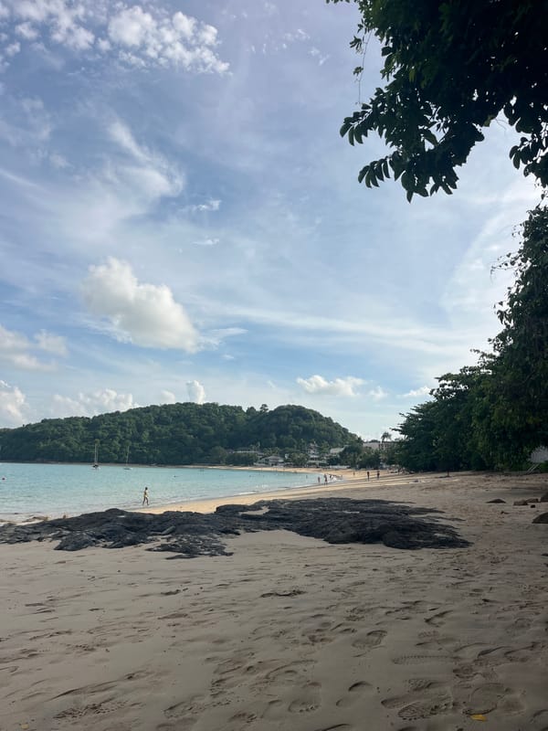 Beach day with swimming, sandcastles, and street food vendors