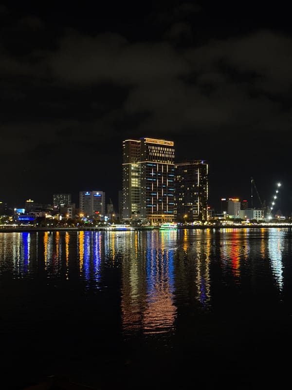 Nighttime Dragon Bridge and Han River illuminated in Da Nang