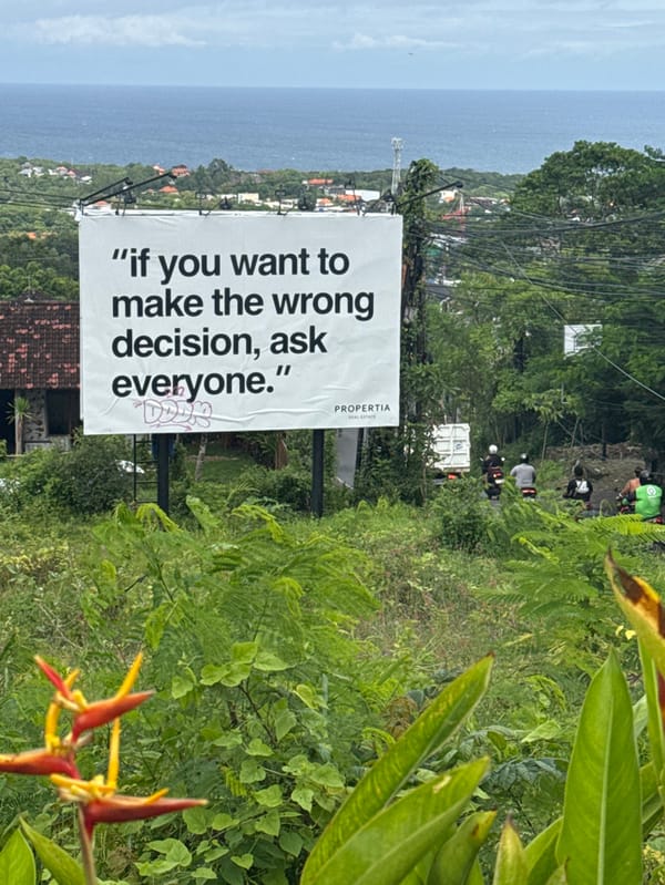 Real estate sign with motivational message spotted in Pecatu