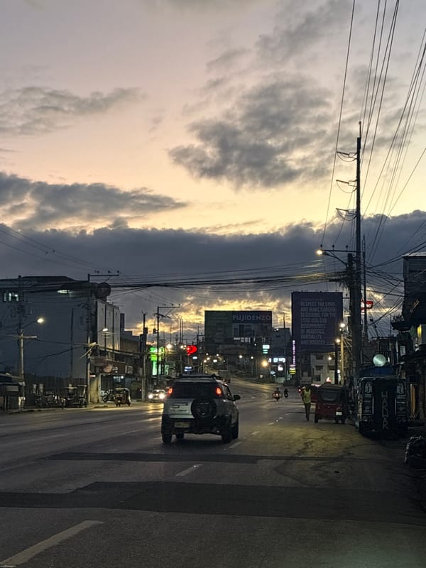Evening motorcycle ride through Davao City at dusk