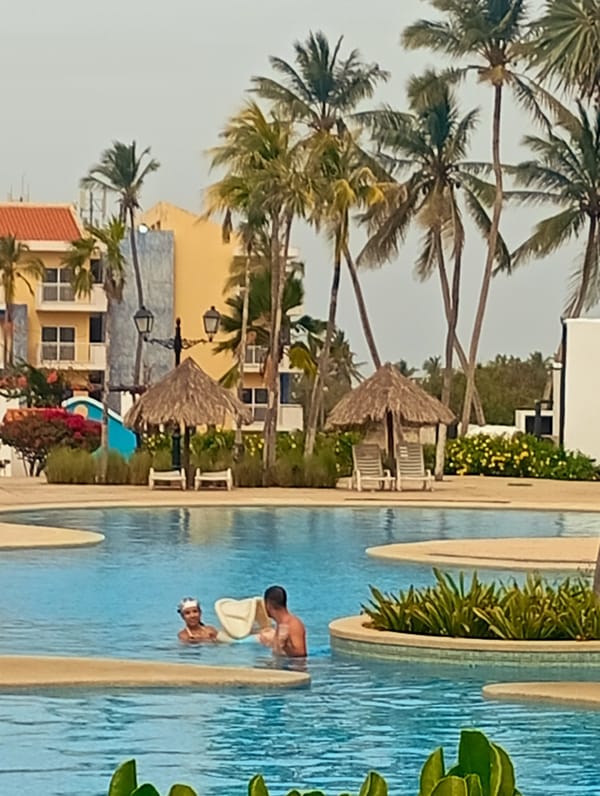 Resort pool activity documented at Playa El Agua, Venezuela