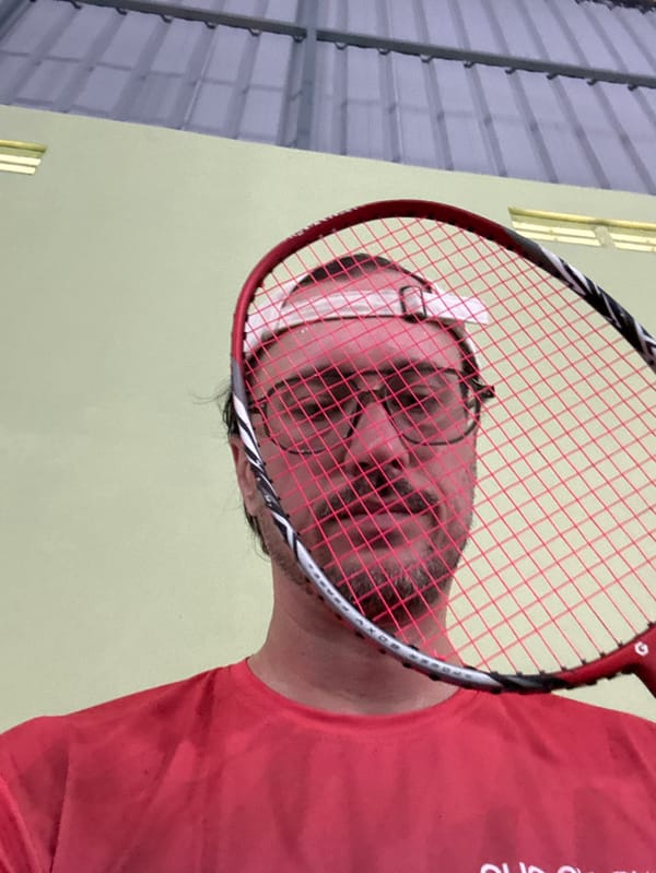 Late-night badminton game recorded at Indonesian gymnasium