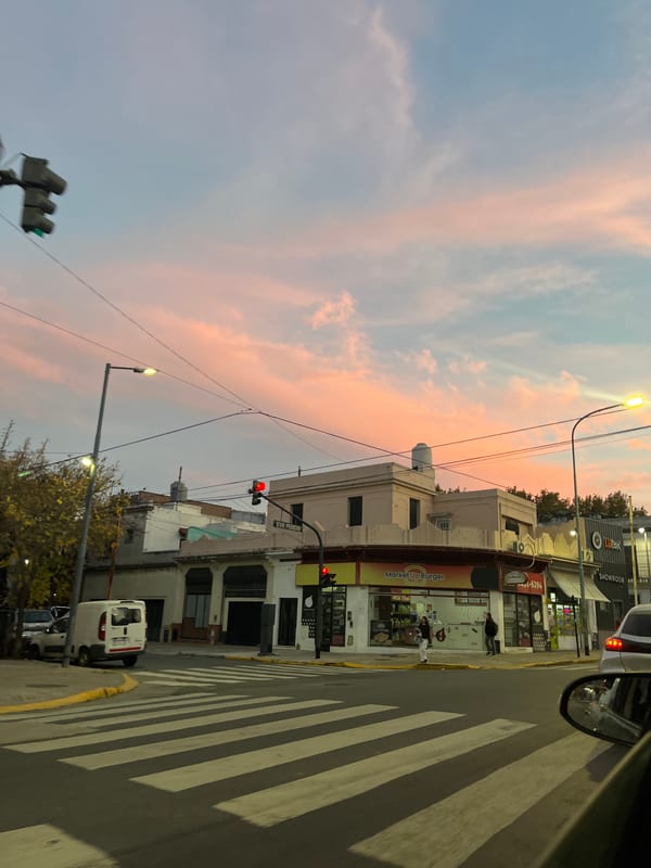 Evening street activity documented in Buenos Aires during dusk