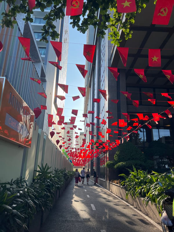 Red flags decorate Nha Trang street amid routine traffic