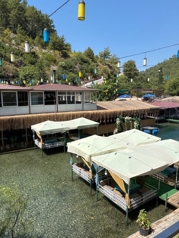 Overwater restaurant on a turquoise river, Alanya