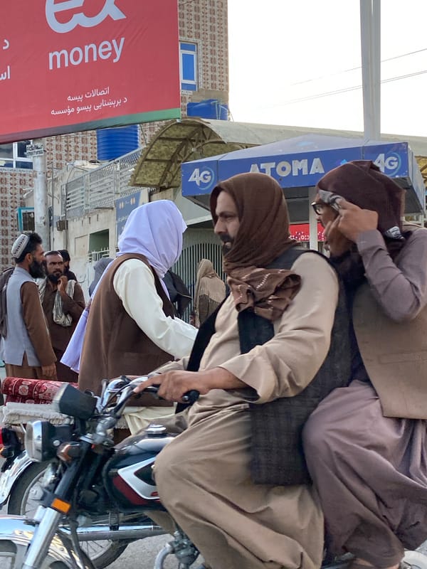 Street activity in Kandahar's market district, midday