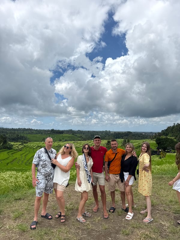 Seven people pose for photo amid rice terraces in Penebel