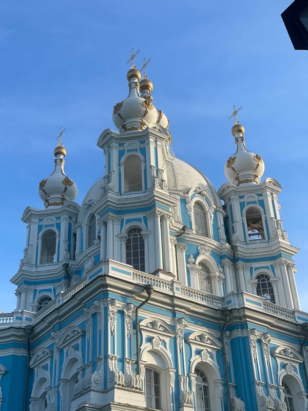 Tourists document afternoon visit to Saint Petersburg's Smolny Cathedral