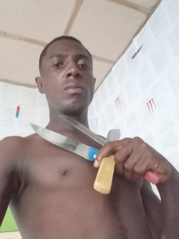 Man photographed in playful indoor session in Akwete, Nigeria