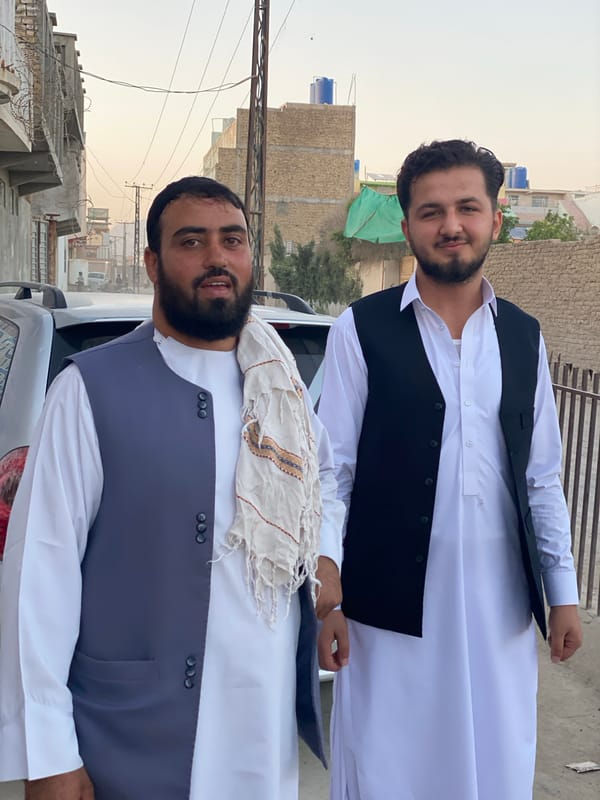 Two men in traditional dress spotted on Kandahar street