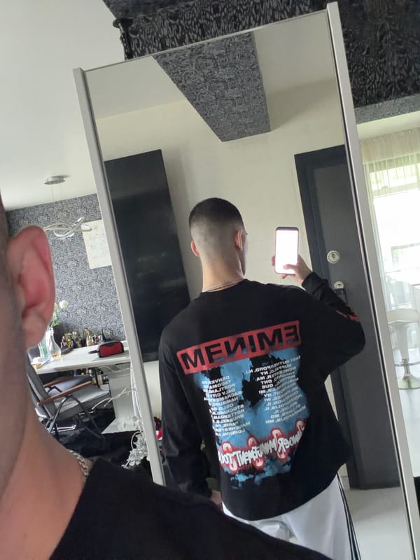 Man takes mirror selfie in Bulgarian home