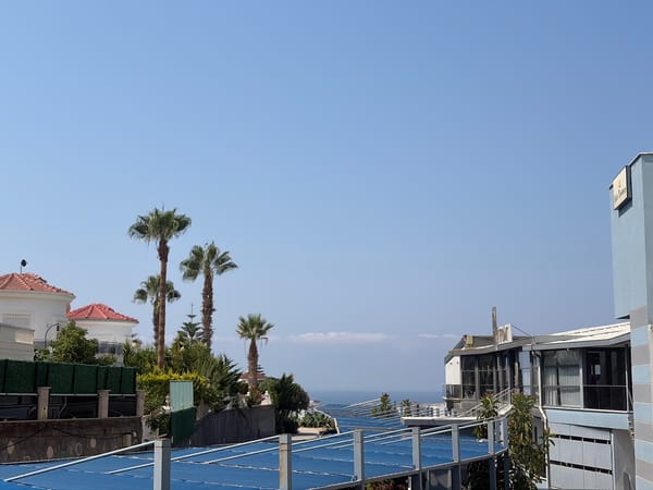 Blue tarp structure meets open sky on the Alanya coast