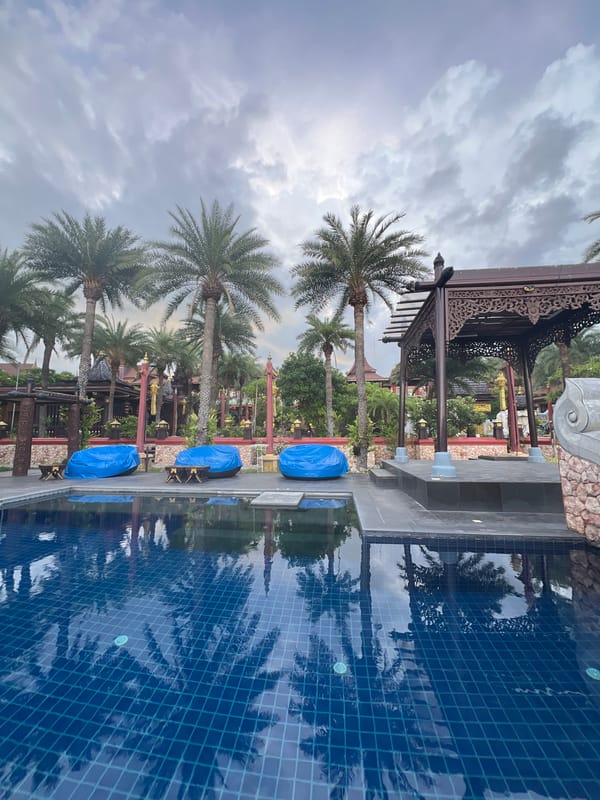 Lazy resort morning in Baan Lamai, pools, gardens, and sea views