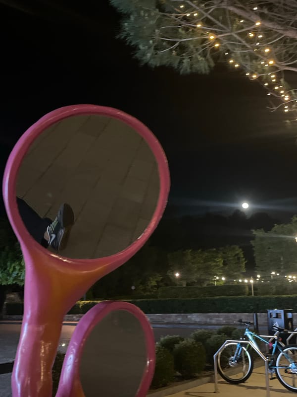 Nighttime stroll through illuminated Tivat captures public art and streetscapes