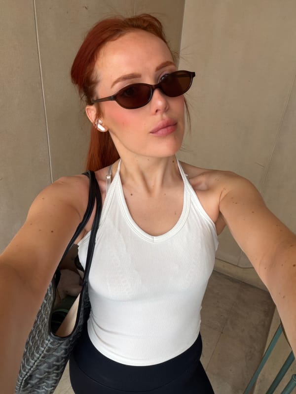 Woman poses for selfie in Paris morning