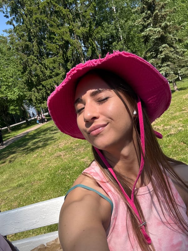 Woman enjoys sunny morning with ice cream in Zelenogorsk park