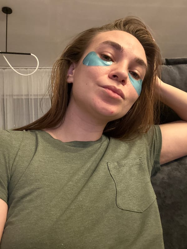 Woman rests with eye patches in Kharnavy, Russia