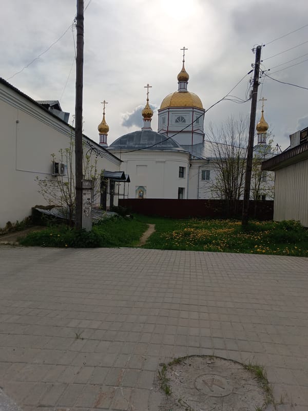 Street scenes captured in Sudogda, Russia showing church and traffic
