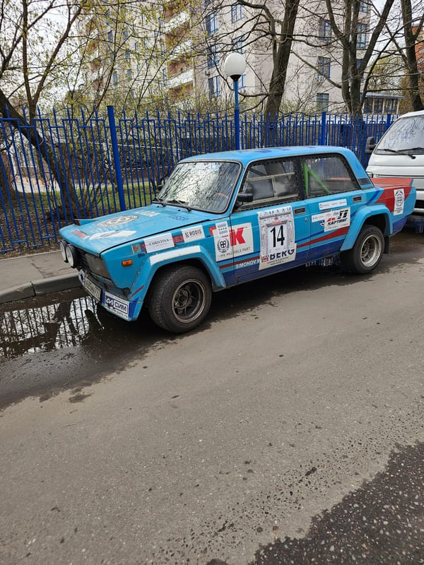Rally car spotted on urban street amid spring scenes