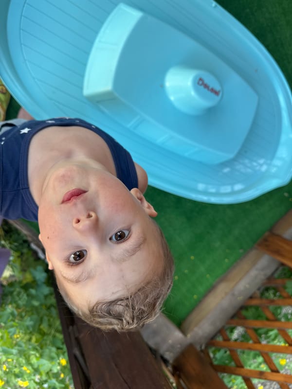 Child plays in backyard garden in Nizhny Novgorod