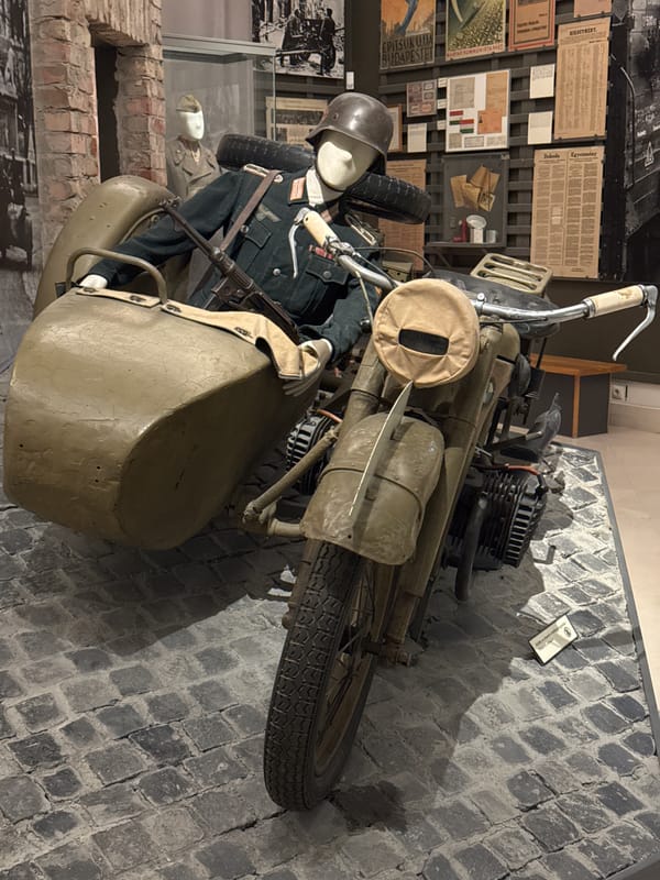Museum visitor documents military exhibits in Budapest