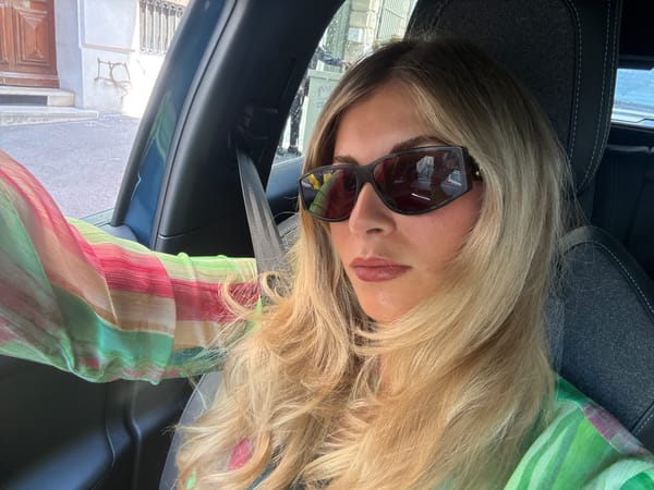 Woman in car observed on sunny Marseille street