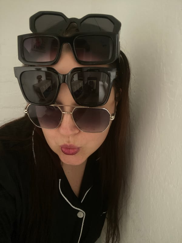 Woman rests wearing hexagonal sunglasses in Sochi